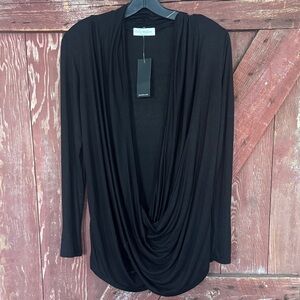 Free to live black super stretch deep drape overlapping front top. NWT. Small.